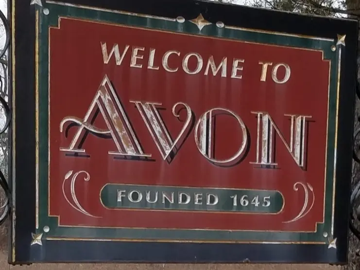 avon-welcome-sign___16110200421 Welcome to Avon, Connecticut town sign surrounded by flowers, with trees in the background. The sign notes the town was founded in 1645.