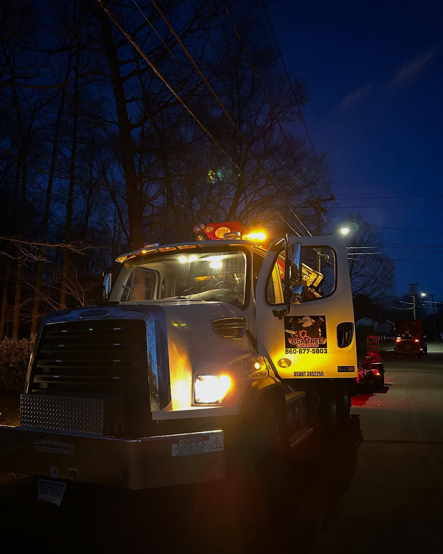Nightwork Wethersfield USA Tree Experts emergency response truck with lights on during nighttime tree service in Wethersfield, CT
